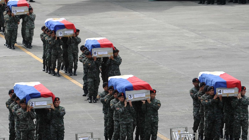 Philippines mourns 44 policemen slain in botched anti-terror raid