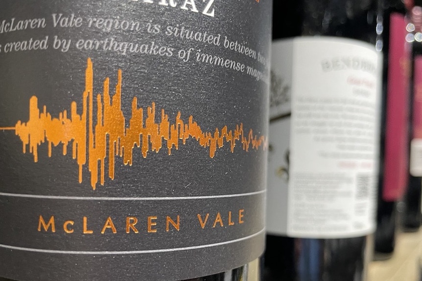 A close up of a bottle of mclaren vale shiraz wine with a black label