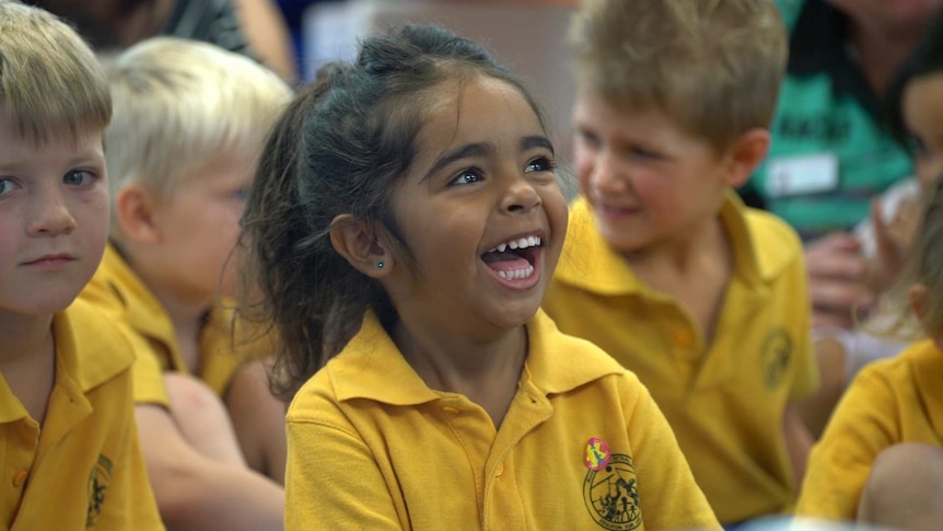 A little indigenous girl laughing