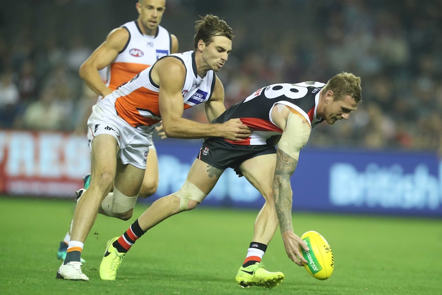 Tim Membrey of St Kilda attempts to pick up the ball