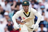 David Warner looks at the ball bouncing as he prepares to take off for a run