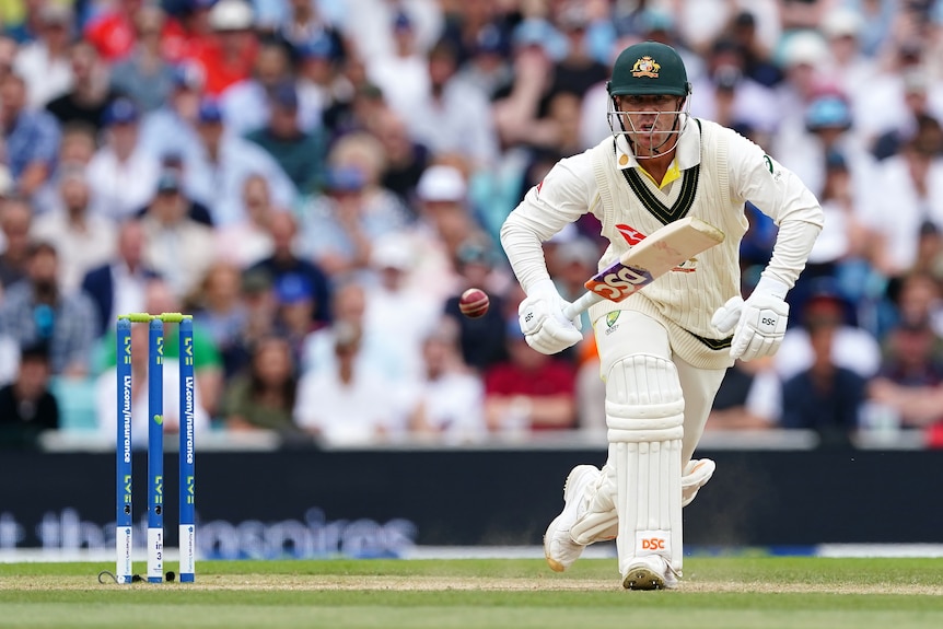 David Warner looks at the ball bouncing as he prepares to take off for a run