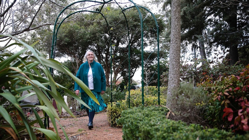 Robyn walking through the garden.