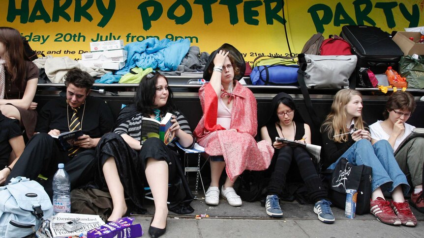 Fans of Harry Potter queue outside a book store