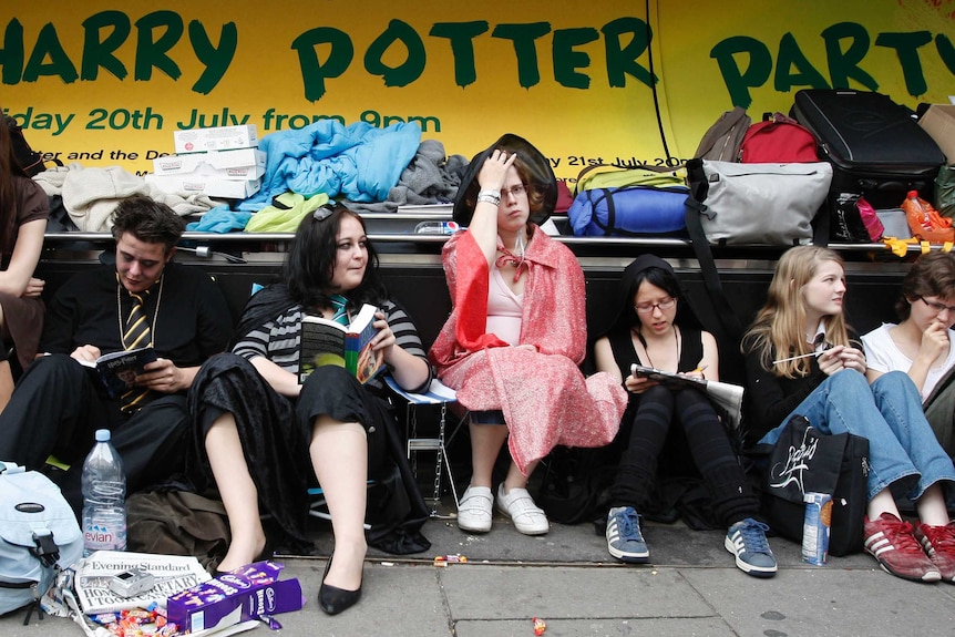 Fans of Harry Potter queue outside a book store