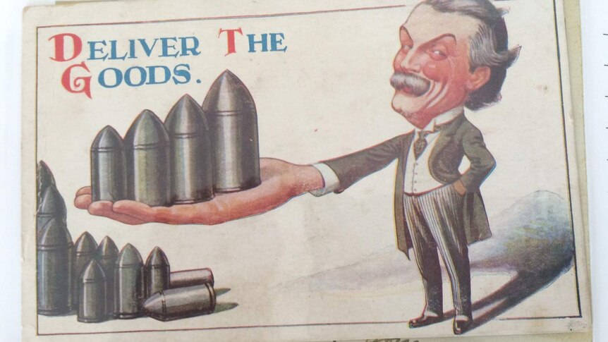 Postcard with caricature of WWI-era man holding handful of bullets with words Deliver the Goods
