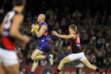 Cruising home...Barry Hall reels in a simple mark against the Bombers.