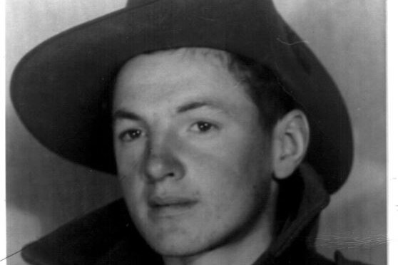 A portrait of Billy Young in his army slouch hat.