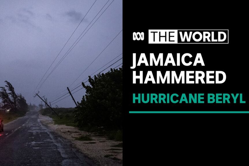 Jamaica Hammered, Hurricane Beryl: Telegraph poles bent over on a rural road in stormy weather.