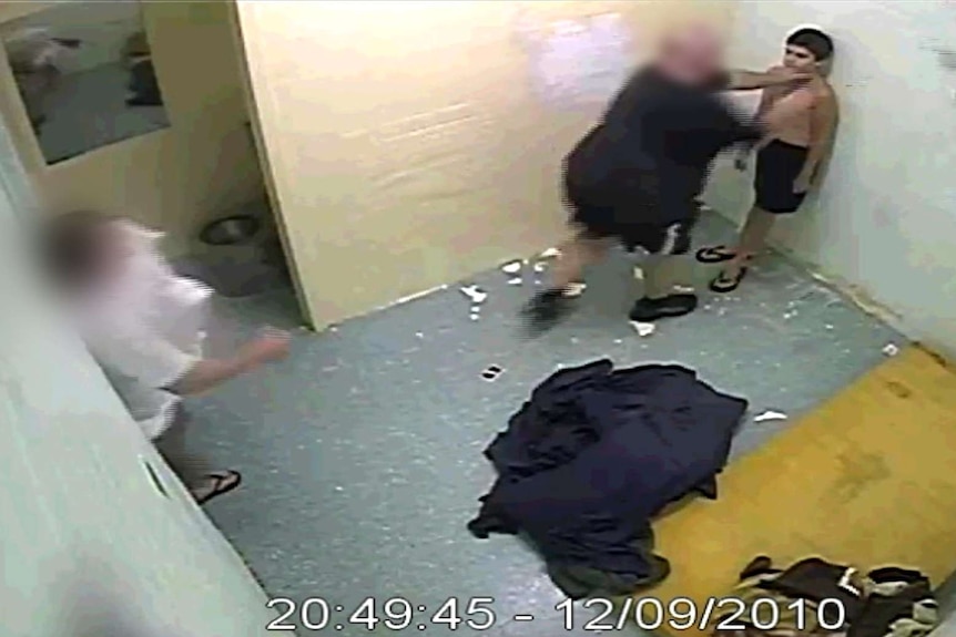 CCTV footage shows a man grabbing a boy around the neck