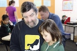 Michael Lightfoot and daughter Eleanor read together at the Active Brain Cafe.