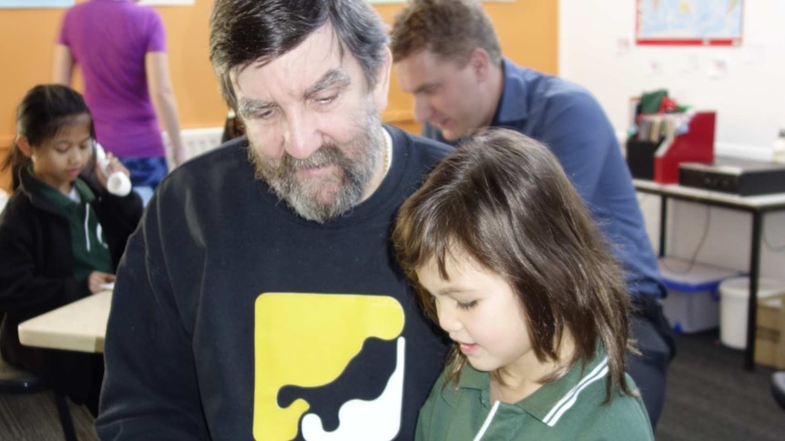 Michael Lightfoot and daughter Eleanor read together at the Active Brain Cafe.