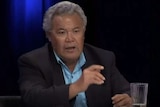 Tuvalu's former prime minister Enele Sopoaga points while sitting at the panel during Q&A