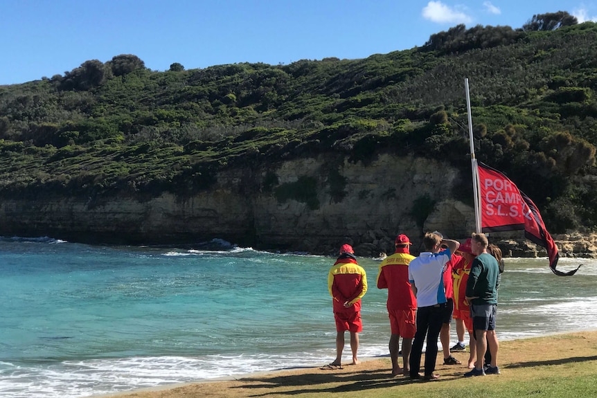 Members of the Port Campbell Surf Lifesaving Club mark minute of silence.