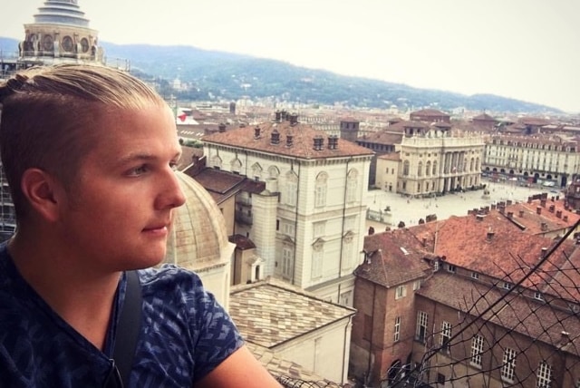 Aidan Carter looks out over an Italian piazza.