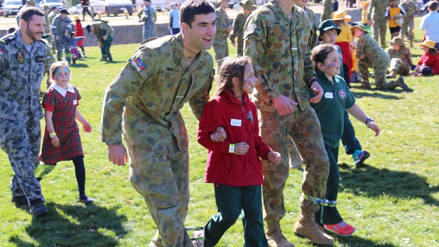Members of the military were happy to help out their junior partners.