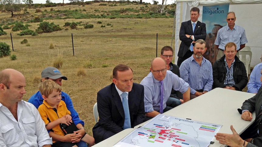 Prime Minister Tony Abbott talks to farmers in Tasmania.