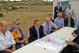 Prime Minister Tony Abbott talks to farmers in Tasmania.