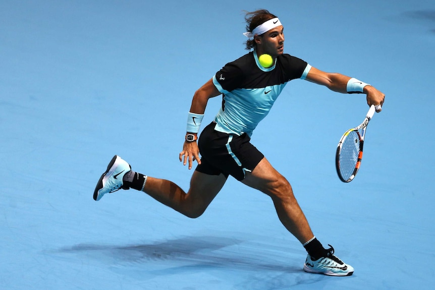 Rafael Nadal runs into a forehand against Andy Murray