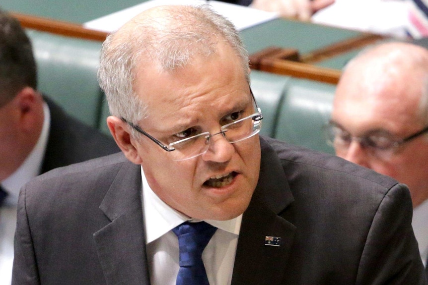 Scott Morrison gestures as he speaks in the House of Representatives.