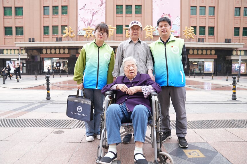 Two case workers with an elderly couple.