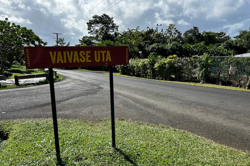 A sign for the Samoan village Vaivase Uta, by a road leading into the village.