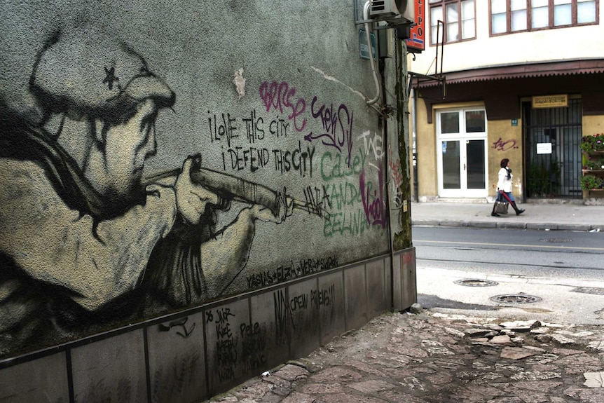 Graffiti in Sarajevo of an armed citizen declaring: "I love this city, I defend this city".