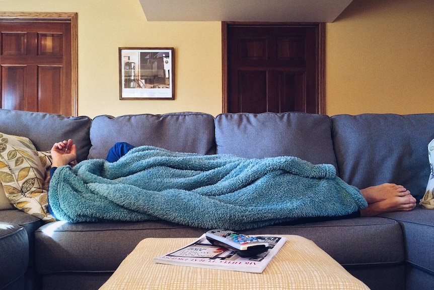 Woman sleeping on couch