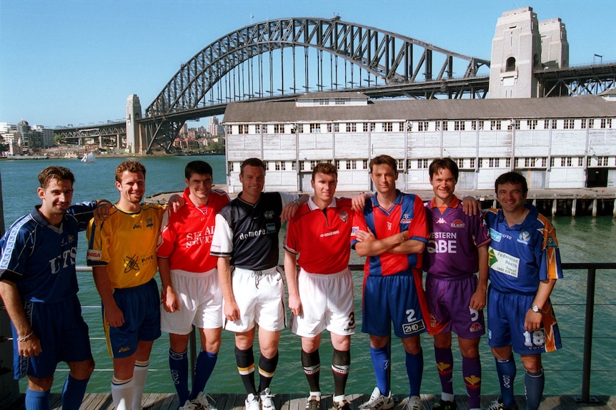 Soccer players wearing their uniforms pose for a photo in Sydney