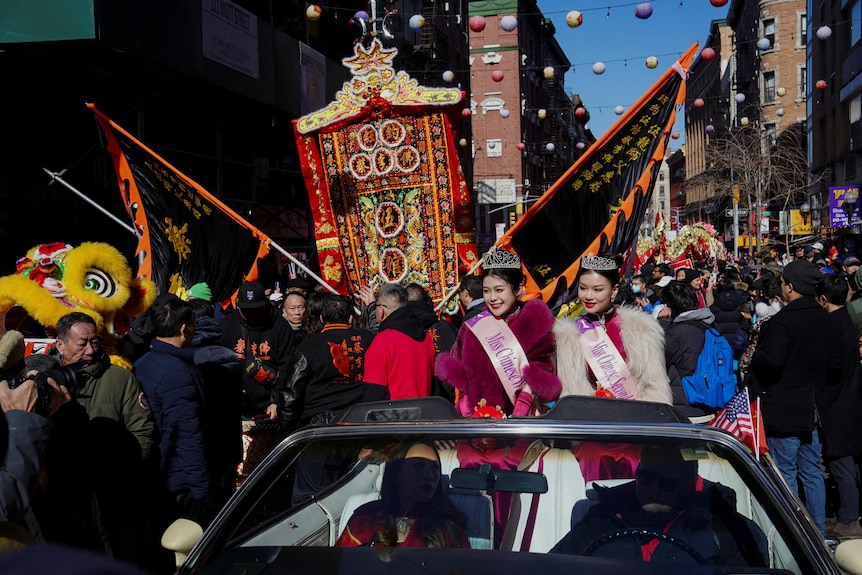 People celebrate Lunar New Year in New York's Chinatown. 