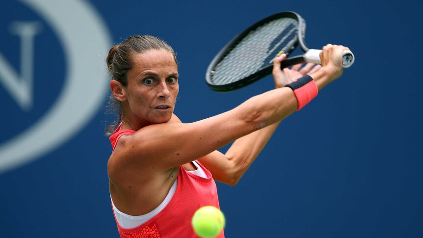 Tough outing ... Roberta Vinci plays a backhand against Flavia Pennetta
