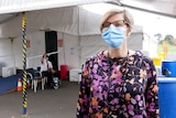  Woman wearing mask outside health tent