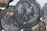 a close up of old bronze coins 