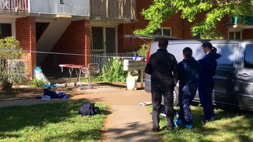 Forensic officers examine the scene after suspicious death in Watson.