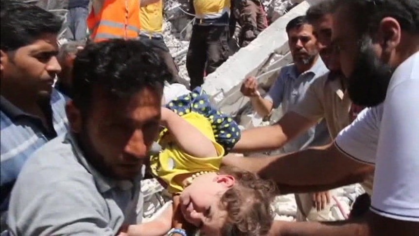 Syrian White Helmets pull children out alive from rubble after explosion.