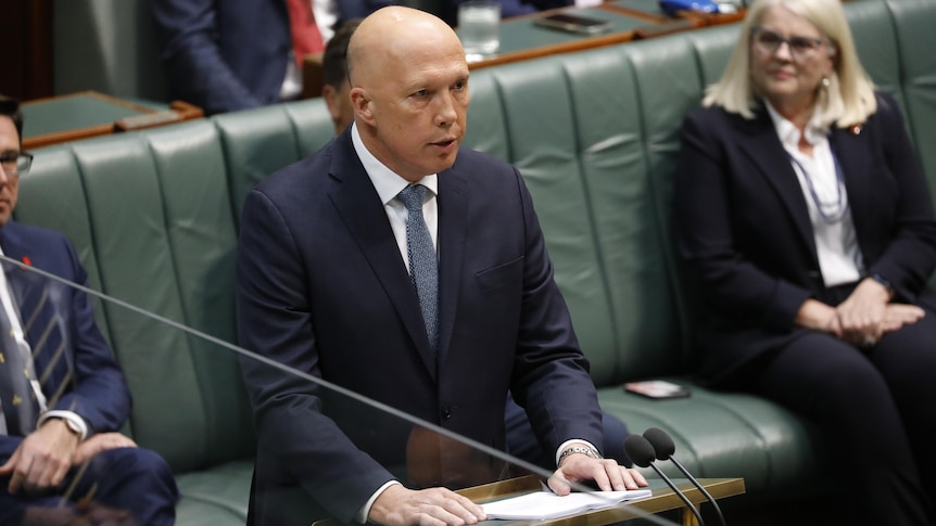 Peter Dutton standing at a lectern. 