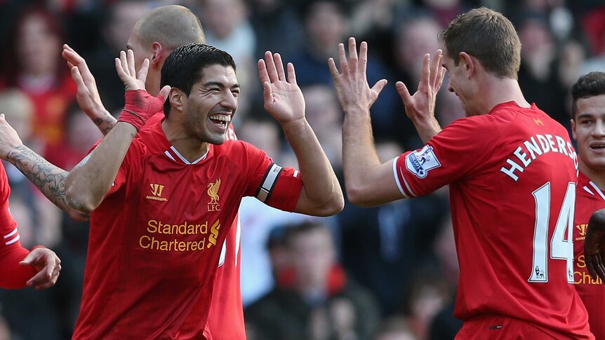 On target ... Luis Suarez (L) of Liverpool celebrates after scoring his second goal with team-mate Jordan Henderson