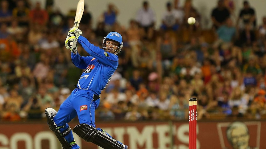 Adelaide Strikers batsman Phil Hughes goes for the bowling against the Perth Scorchers at the WACA.