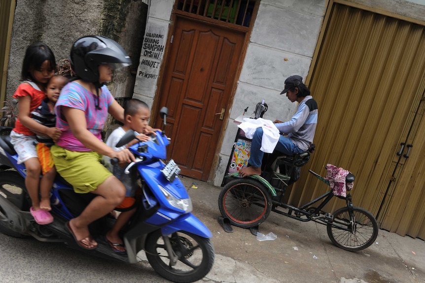 Family takes a ride on their scooter