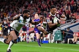 Filipo Daugunu of the Queensland Reds dives in for a try infront of a crowd at suncorp stadium in brisbane
