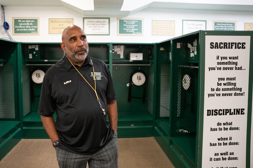 A coach in a locker room.