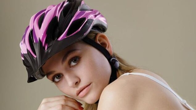 Germany's Next Top Model contestant Alicija Kohler poses in a bicycle helmet and bra.