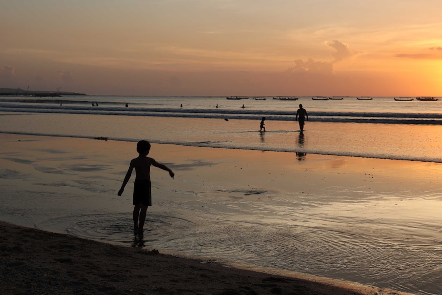 Kuta beach at sunset.