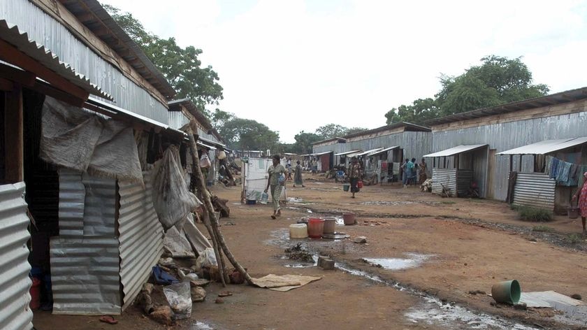 Internally displaced people (IDPs) walk inside the Ananda Kumarswami camp at Manik Farm