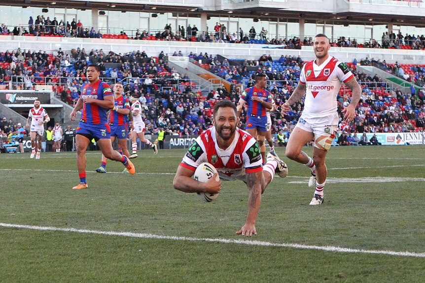 Benji Marshall dives over against the Newcastle Knights