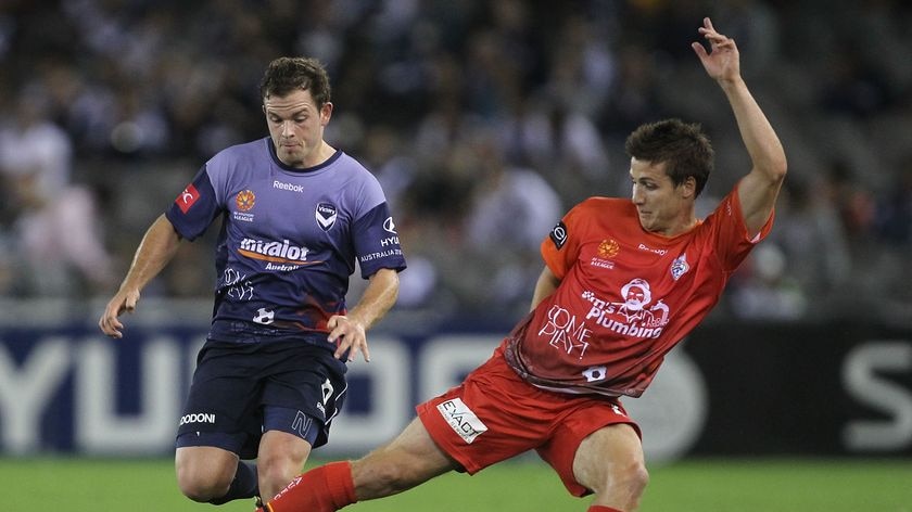 Melbourne-bound...Marrone steals the ball from the Victory's Leigh Broxham.