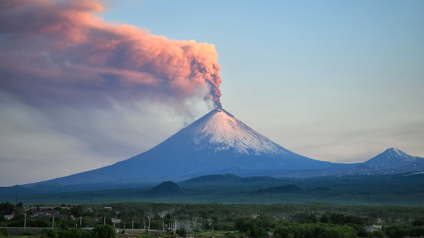 Pink-grey smoke billows from the top of  Klyuchevskaya Sopka volcano, near the village of Klyuchi in Russia.