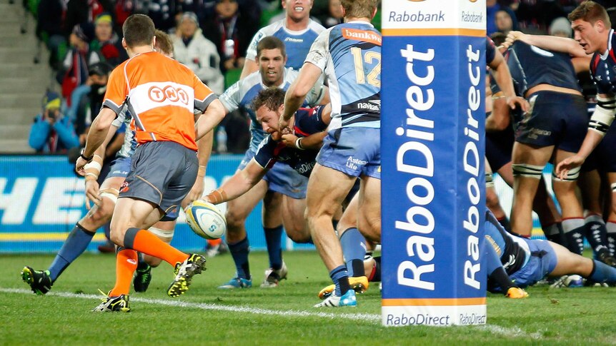 Scott Higginbotham touches down for the Rebels against the Force