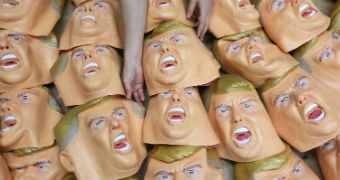 A pile of flat Donald Trump rubber masks.