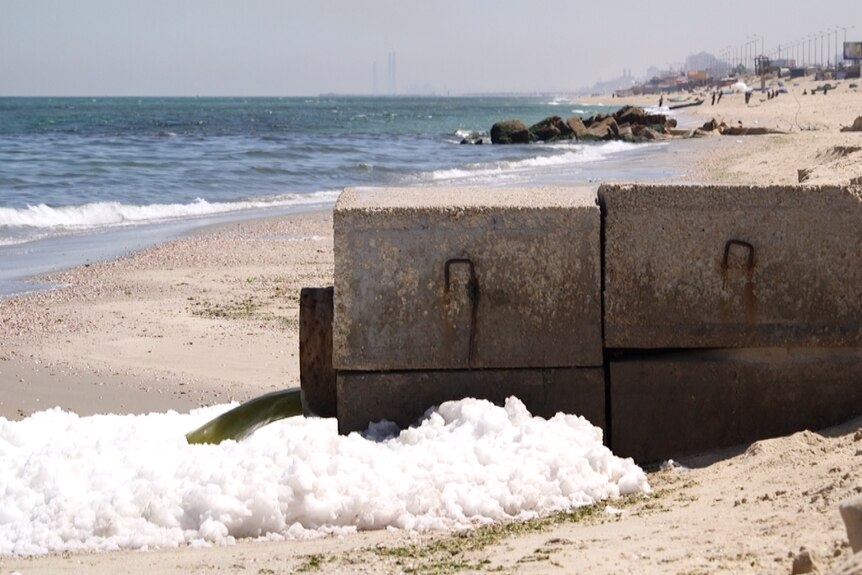 Pipe on Gaza's beachfront spews sewage into the Mediterranean.